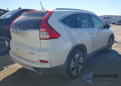 2015 Honda Cr-V Touring z USA, uszkodzony, nr VIN 5J6RM3H94FL021628